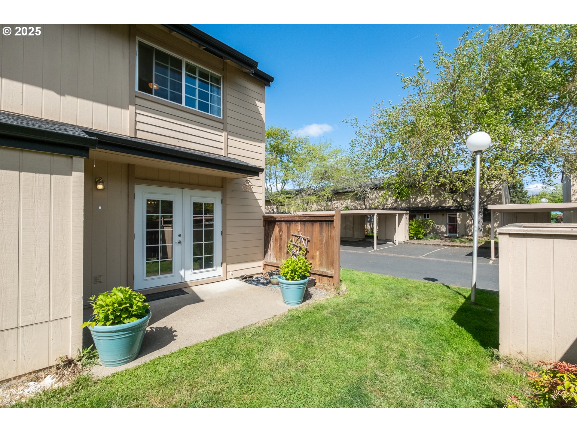1548 Fetters Loop Eugene, OR 97402 - Photo 28 of 33 a view of a house with backyard sitting area and garden