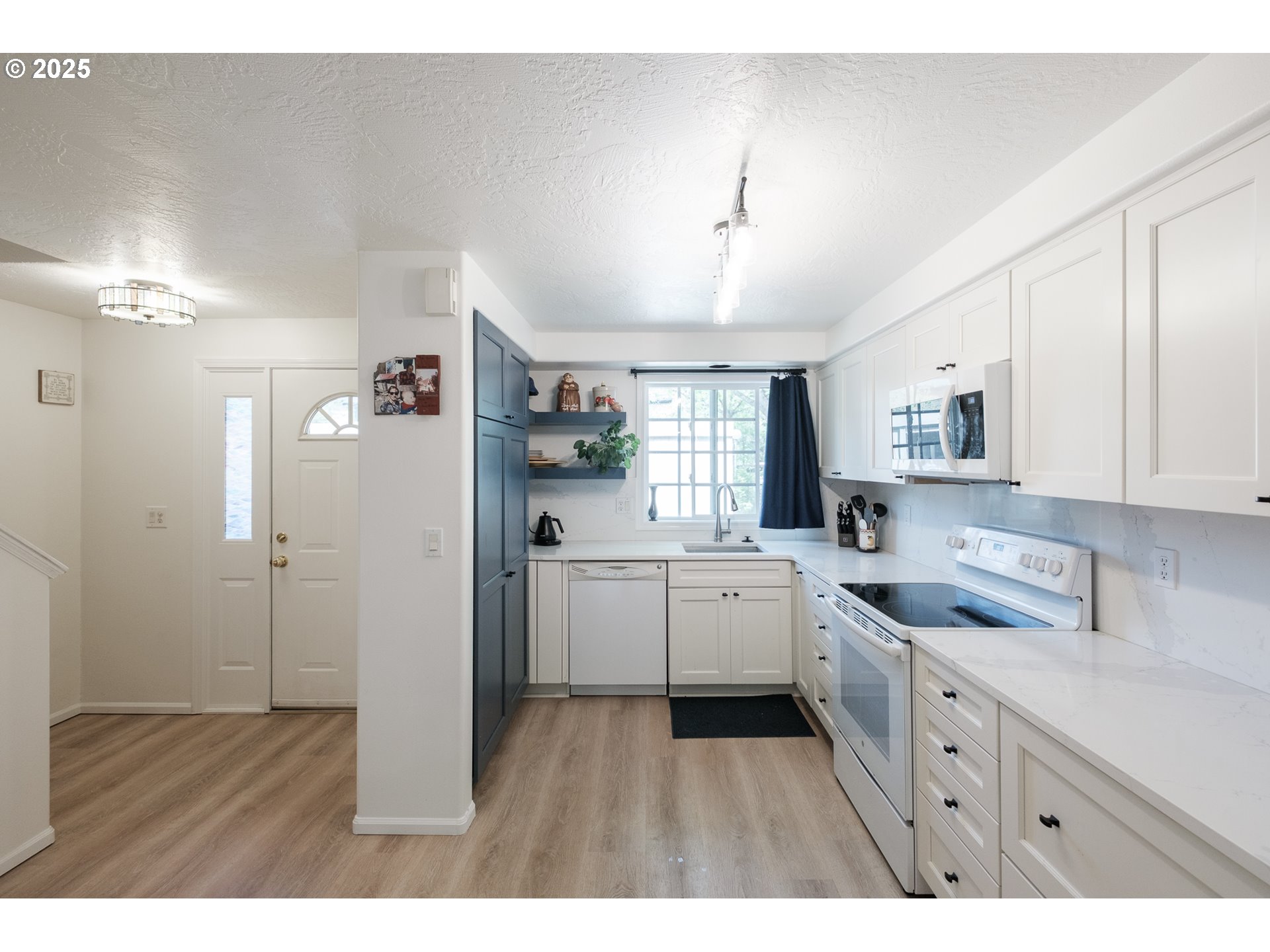 1548 Fetters Loop Eugene, OR 97402 - Photo 5 of 33 a kitchen with cabinets and window