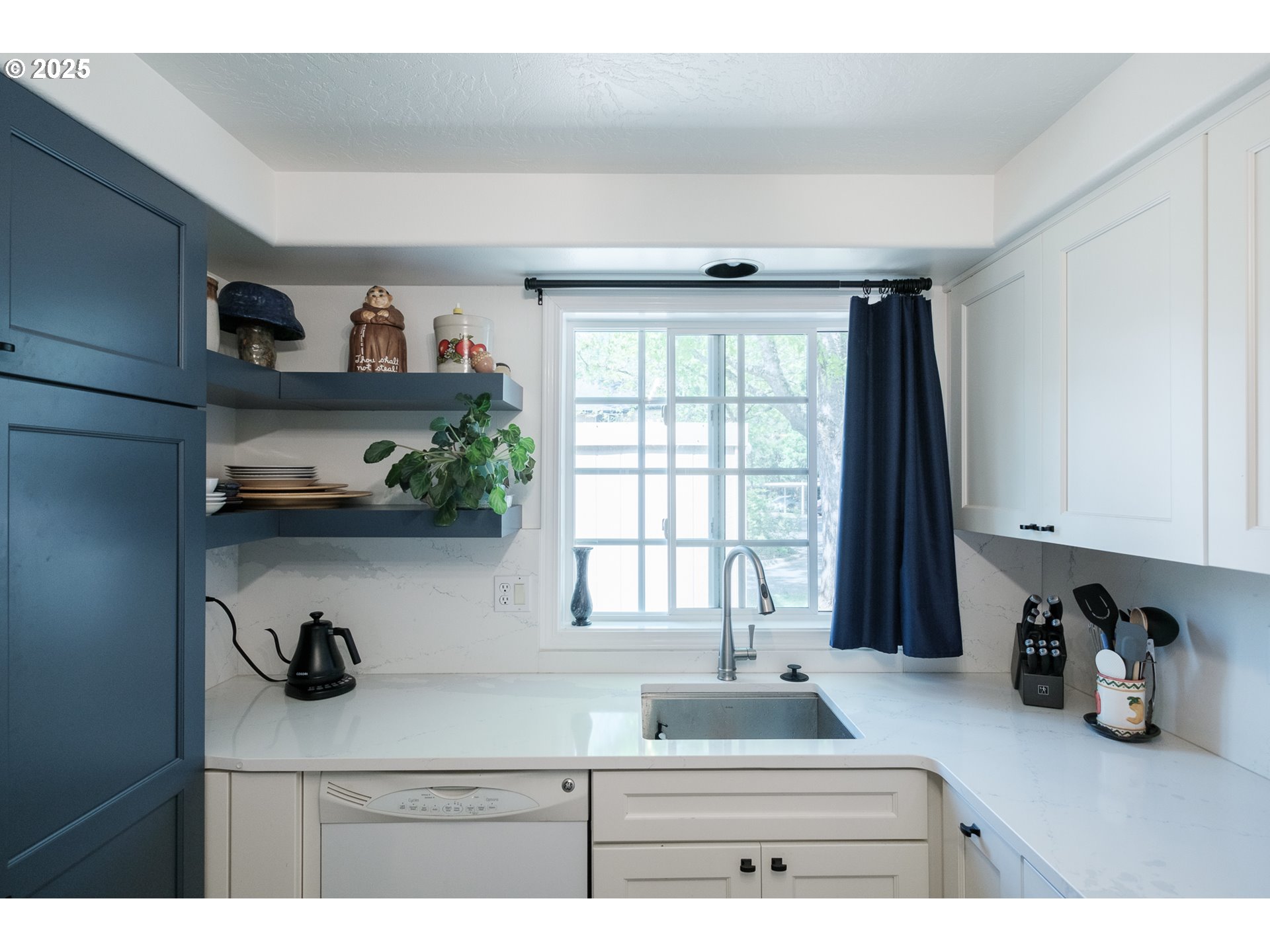 1548 Fetters Loop Eugene, OR 97402 - Photo 8 of 33 a kitchen with a refrigerator and a sink