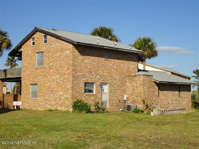 284 Barrataria Drive St. Augustine, FL 32080 - Photo 18 of 24 a front view of a house with a yard
