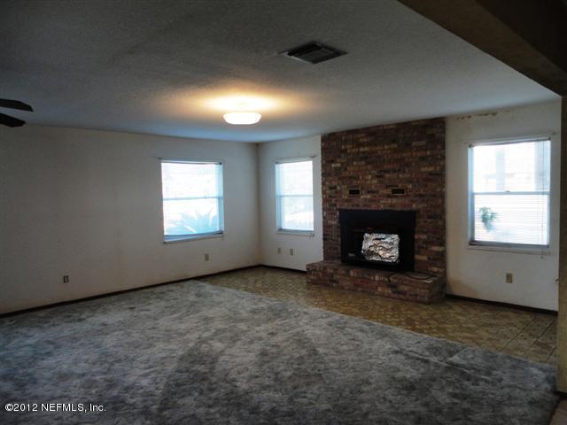 284 Barrataria Drive St. Augustine, FL 32080 - Photo 4 of 24 an empty room with windows