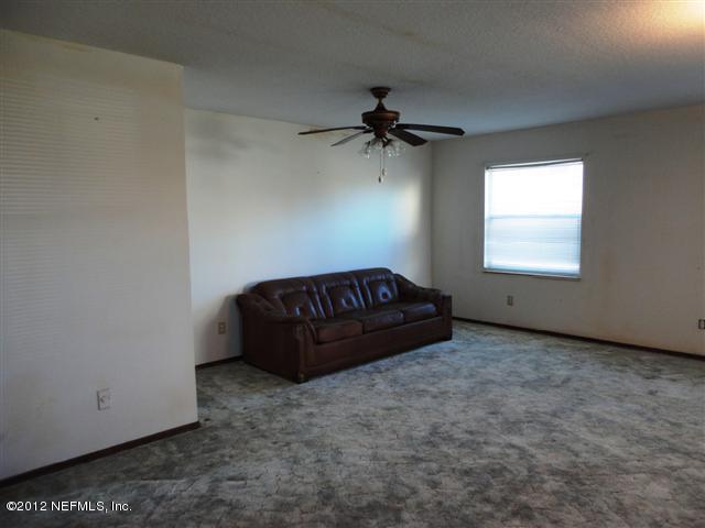 284 Barrataria Drive St. Augustine, FL 32080 - Photo 5 of 24 a view of a room with a ceiling fan and a window