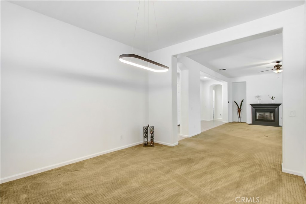 36109 Eagle Lane Beaumont, CA 92223 - Photo 11 of 42 a view of empty room with a fireplace