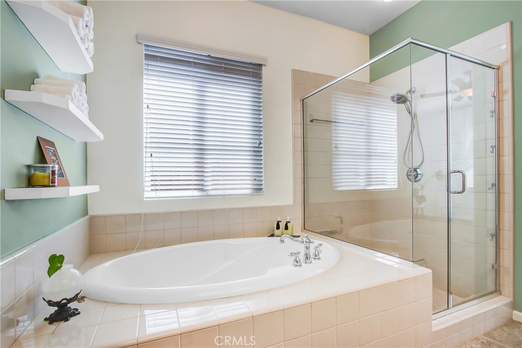 36109 Eagle Lane Beaumont, CA 92223 - Photo 30 of 42 a white bath tub sitting under a bathroom next to a window