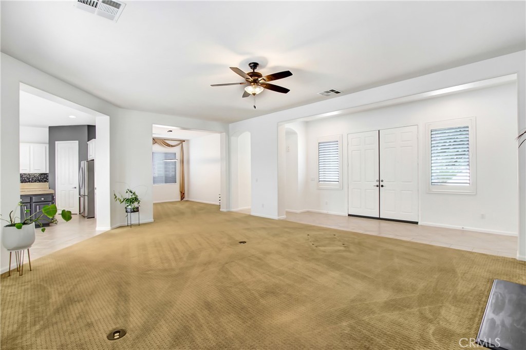 36109 Eagle Lane Beaumont, CA 92223 - Photo 5 of 42 a view of a livingroom with a chandelier fan and windows