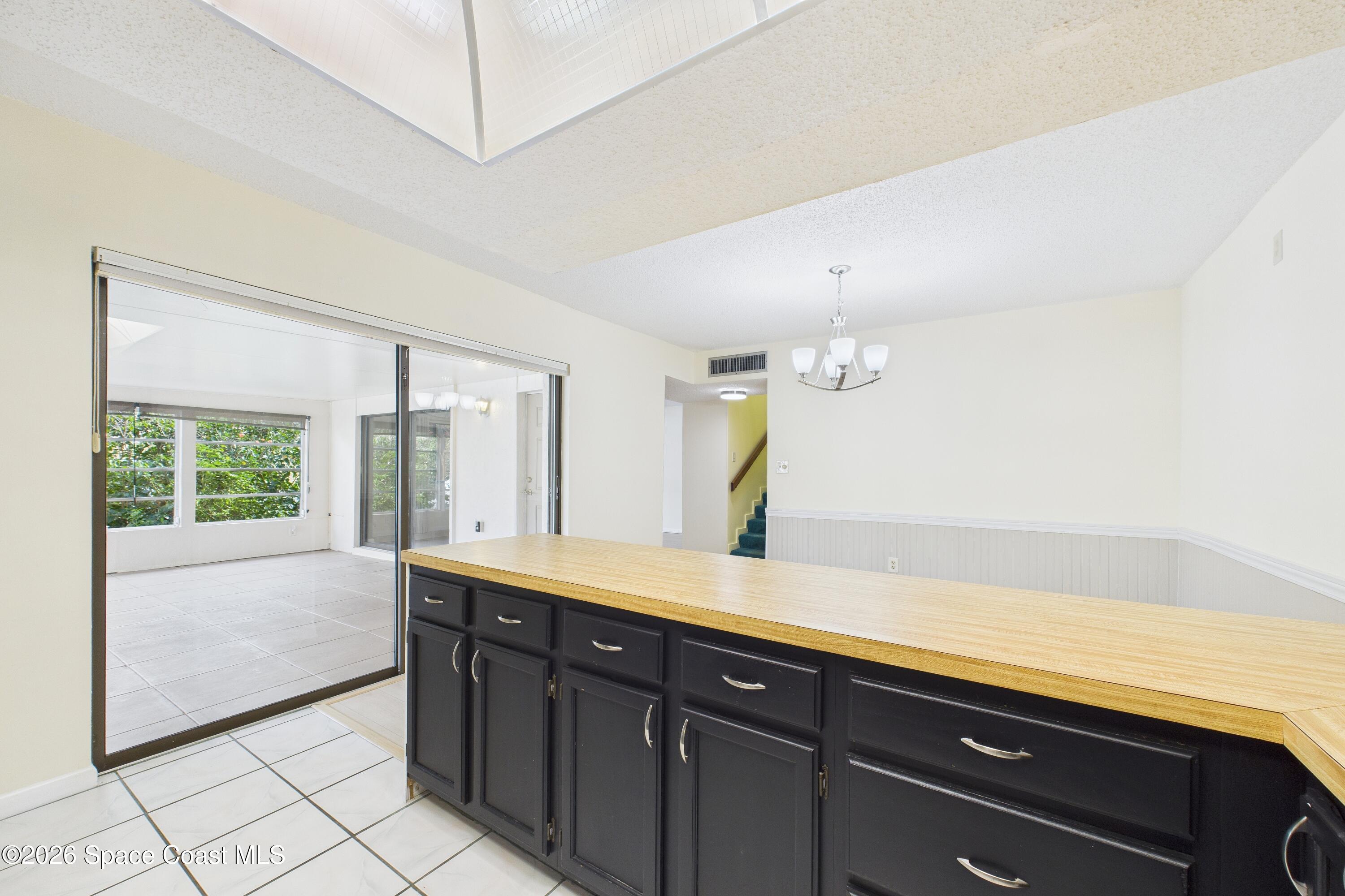 a spacious bathroom with a sink a large mirror and a bathtub next to a window