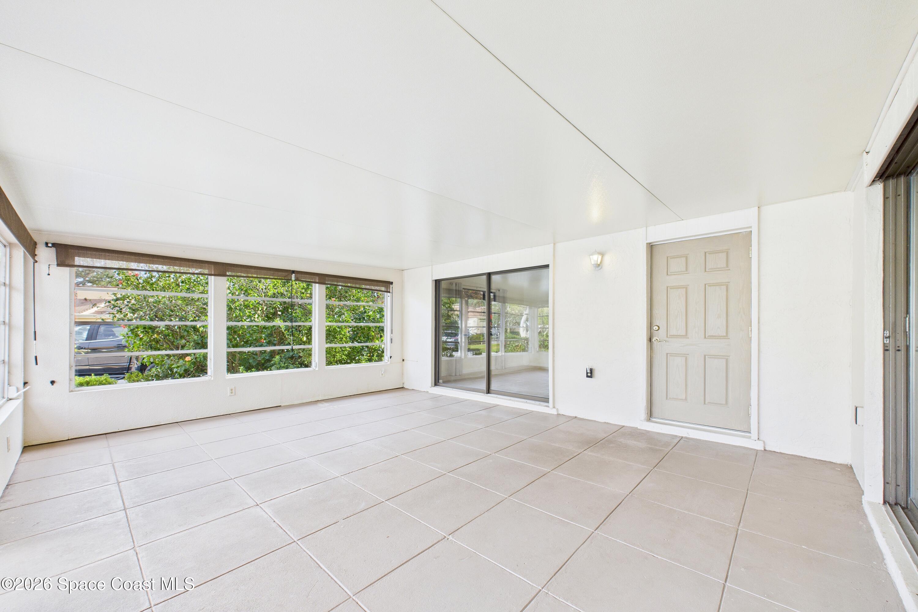 204 Country Club Drive Melbourne, FL 32940 - Photo 11 of 63 a view of an empty room with a window