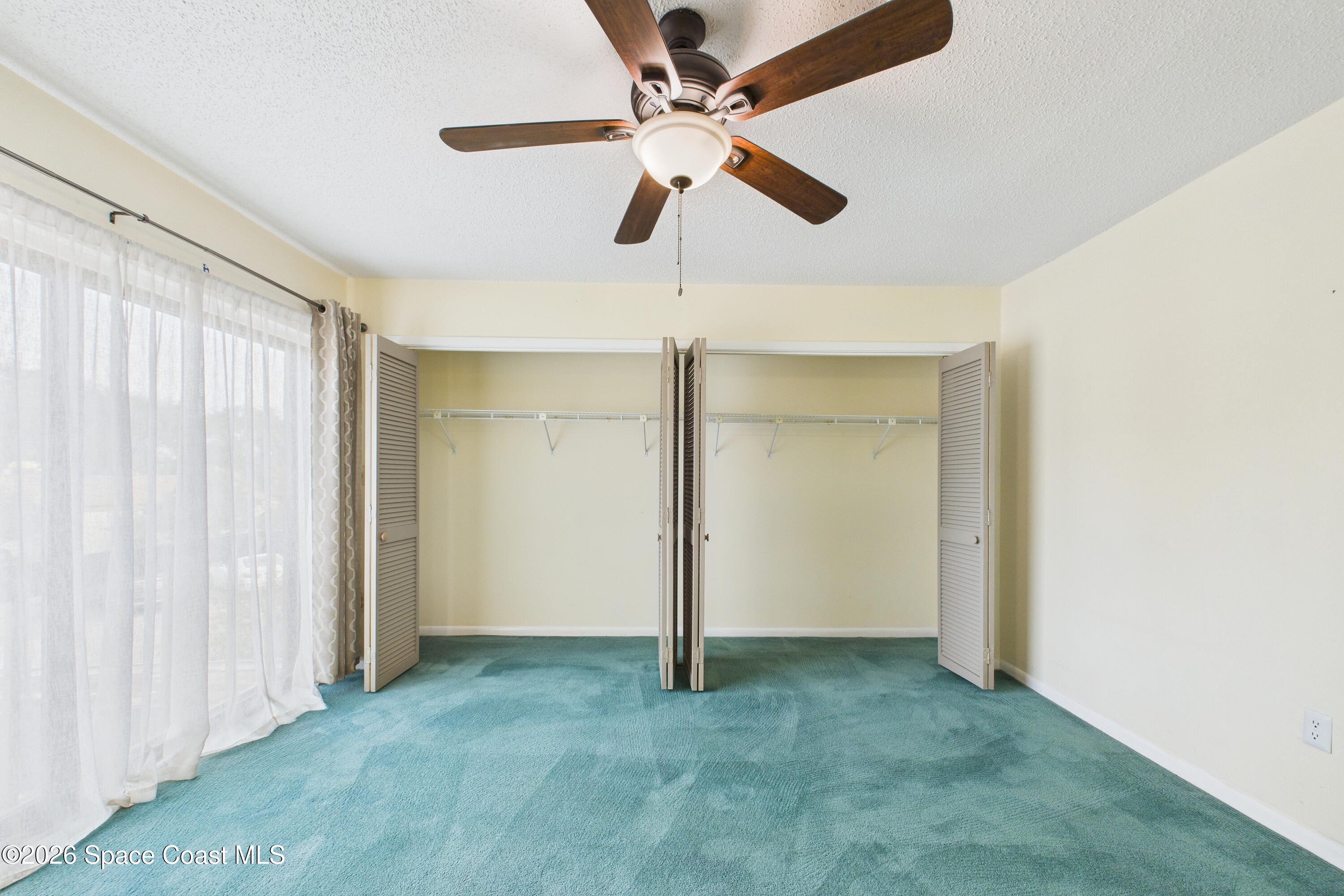 204 Country Club Drive Melbourne, FL 32940 - Photo 15 of 63 a view of empty room with ceiling fan