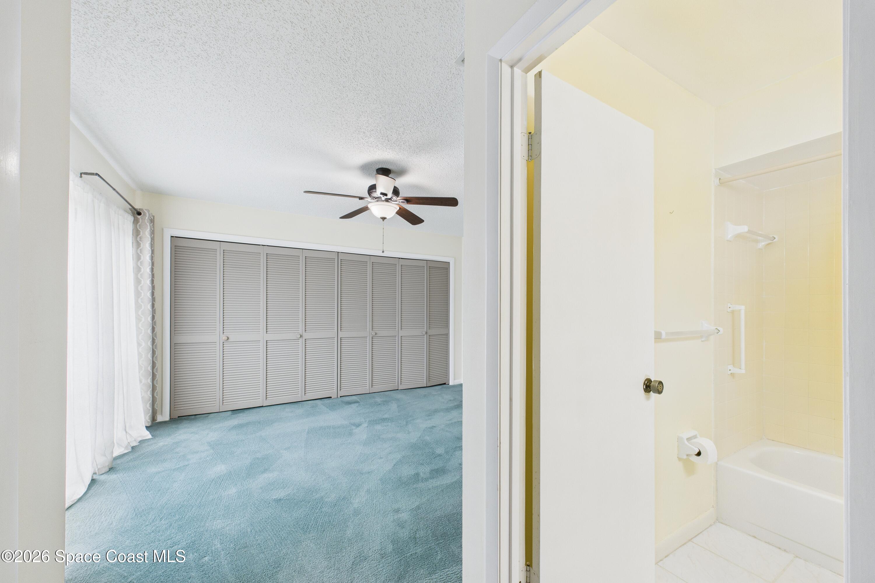 204 Country Club Drive Melbourne, FL 32940 - Photo 16 of 63 a view of a bathroom with a bathtub