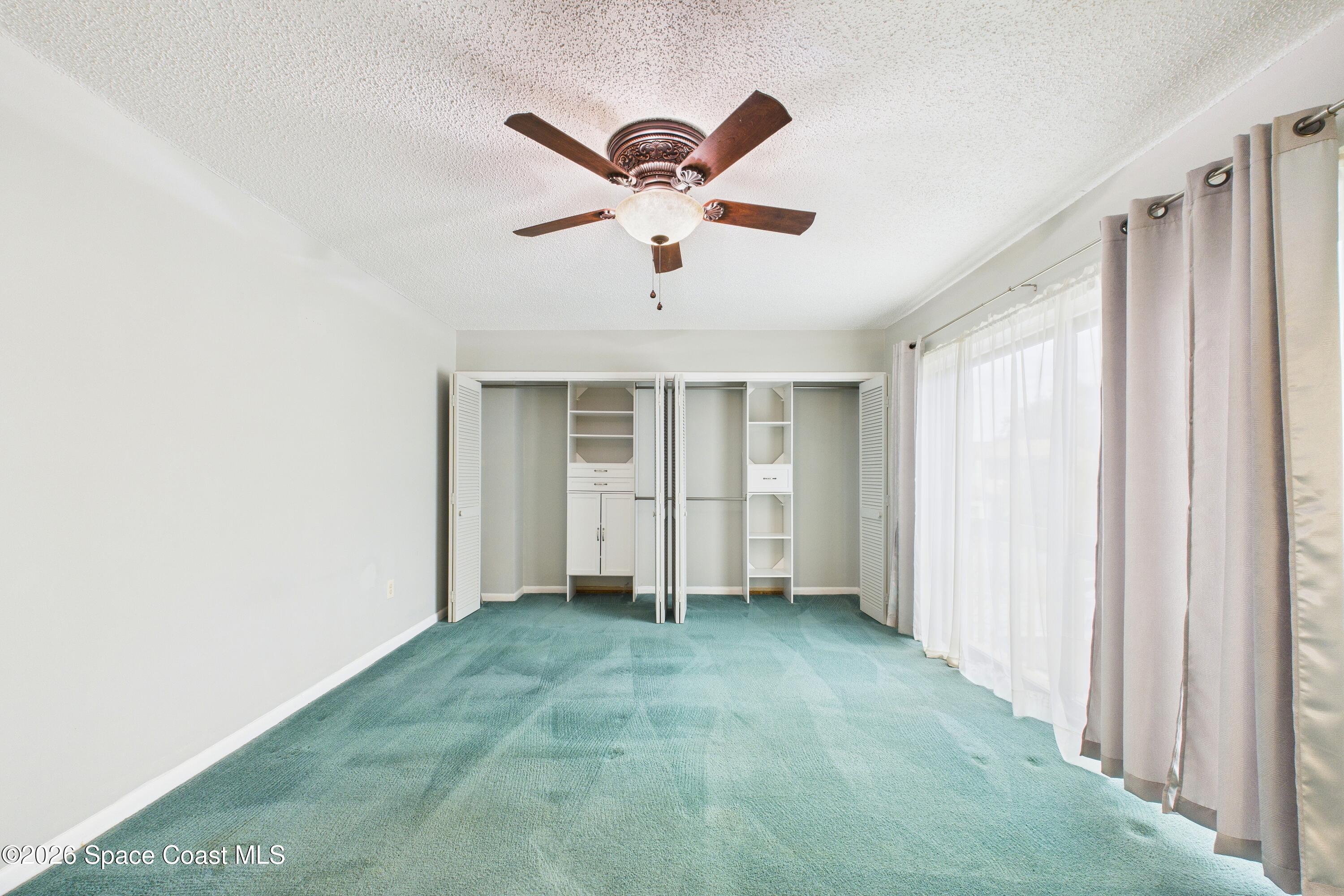 204 Country Club Drive Melbourne, FL 32940 - Photo 17 of 63 a view of empty room with ceiling fan