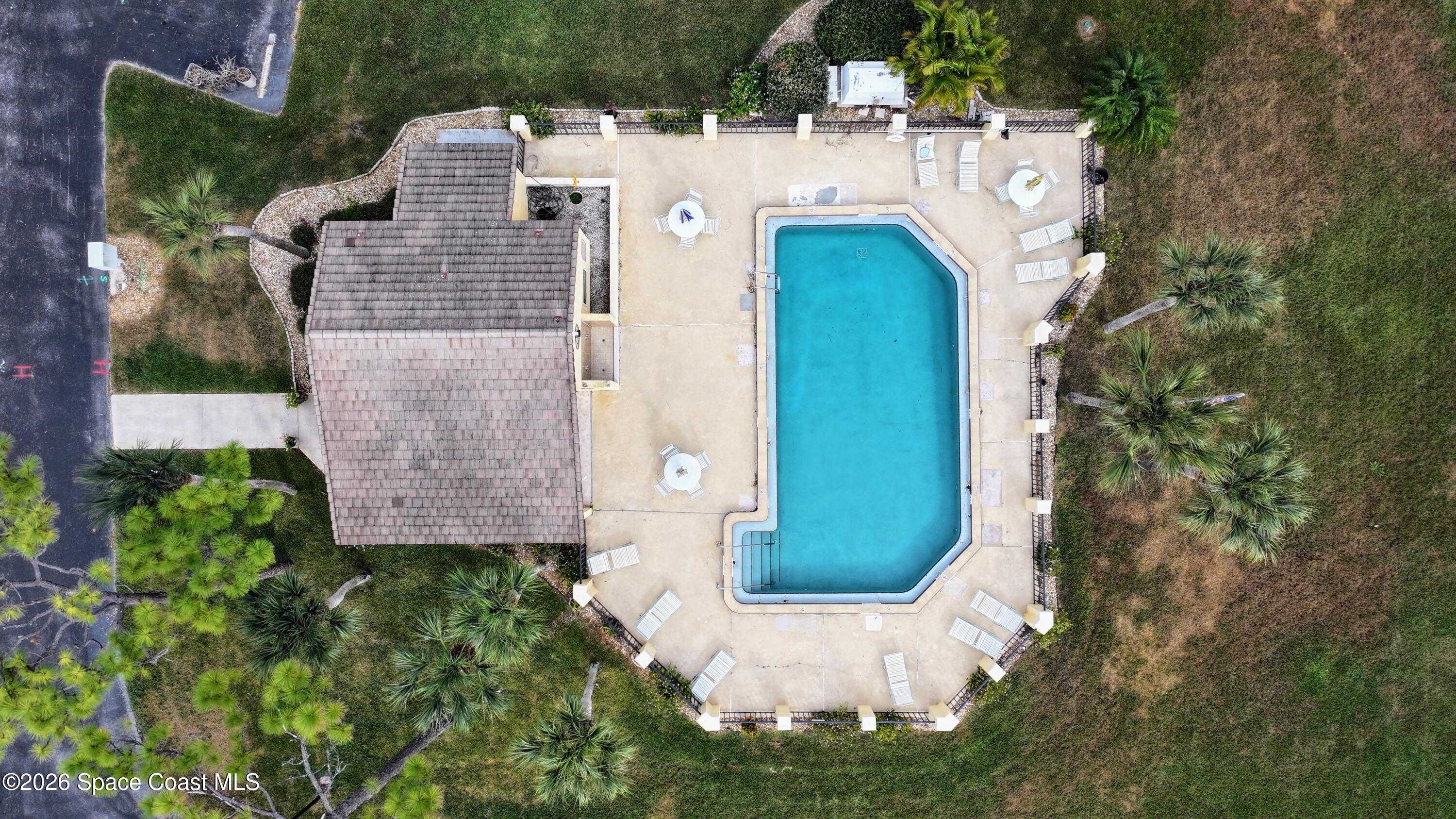 204 Country Club Drive Melbourne, FL 32940 - Photo 26 of 63 an aerial view of a house with a yard