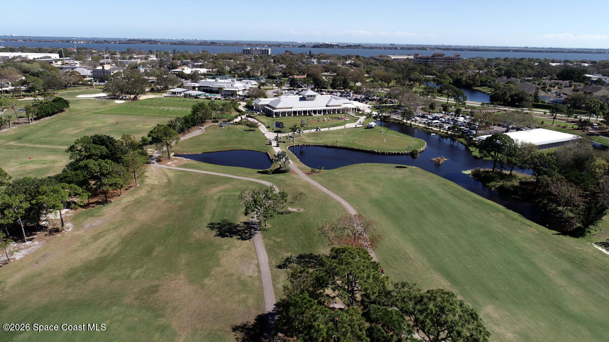 204 Country Club Drive Melbourne, FL 32940 - Photo 28 of 63 an aerial view of residential houses with outdoor space