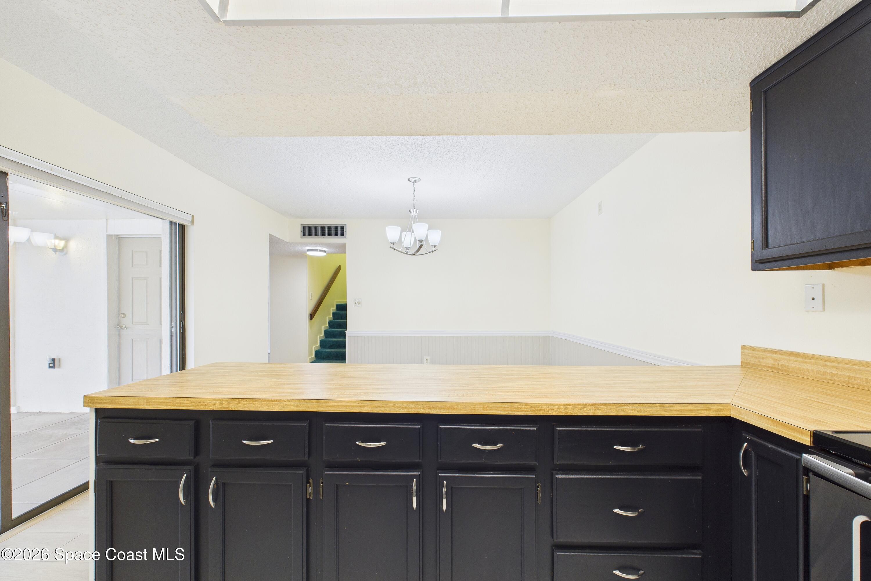 204 Country Club Drive Melbourne, FL 32940 - Photo 3 of 63 a bathroom with a sink and a mirror