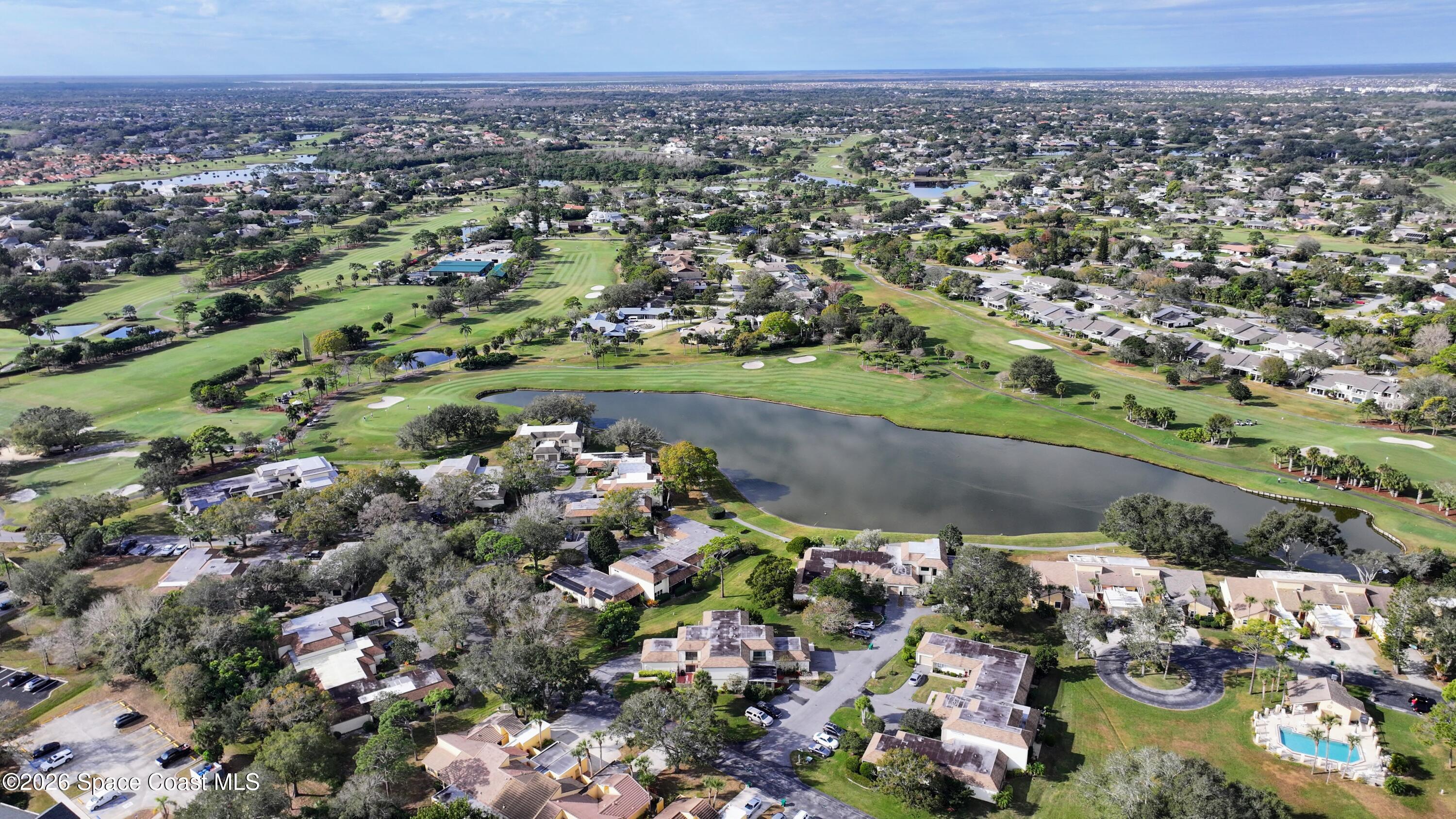 204 Country Club Drive Melbourne, FL 32940 - Photo 32 of 63 an aerial view of a residential houses with outdoor space and swimming pool