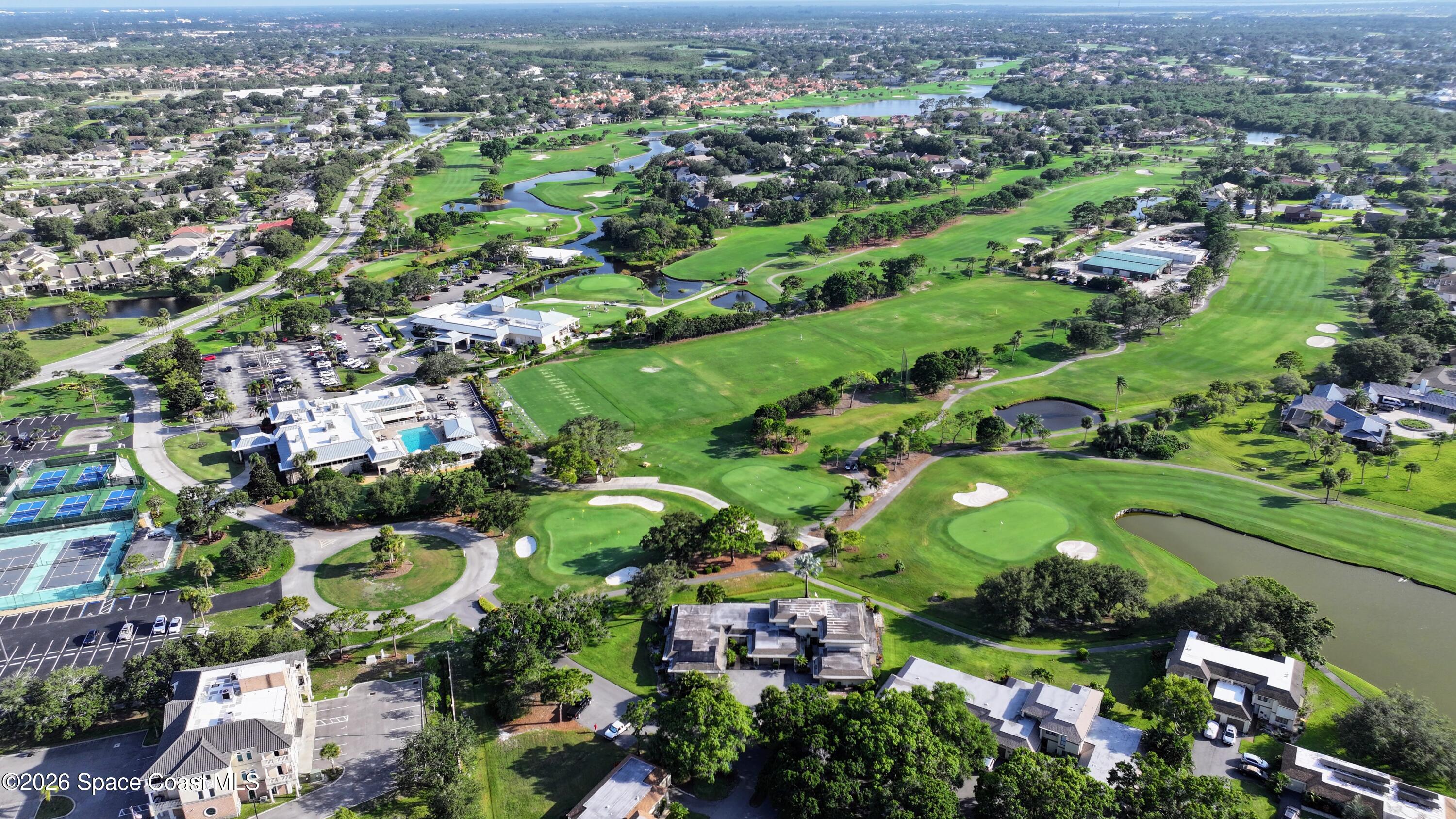 204 Country Club Drive Melbourne, FL 32940 - Photo 34 of 63 an aerial view of residential houses with outdoor space