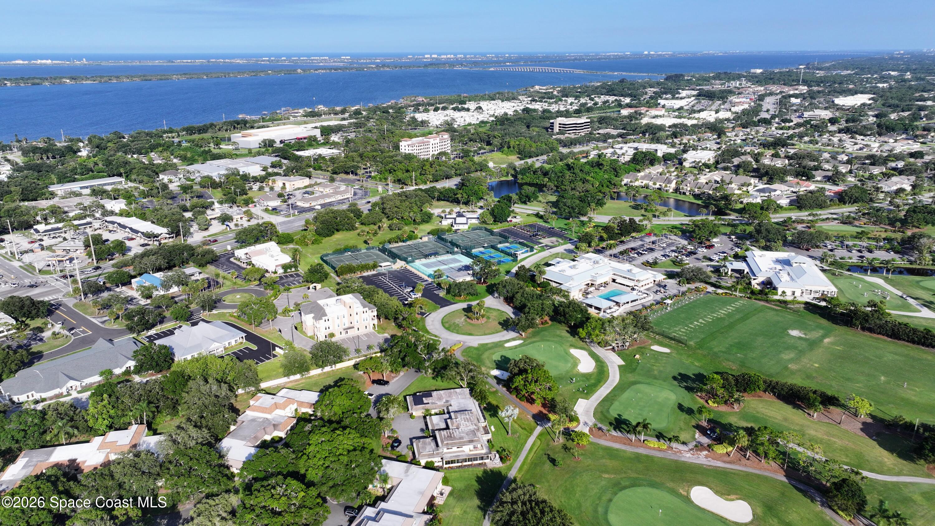 204 Country Club Drive Melbourne, FL 32940 - Photo 35 of 63 an aerial view of residential houses with outdoor space and trees