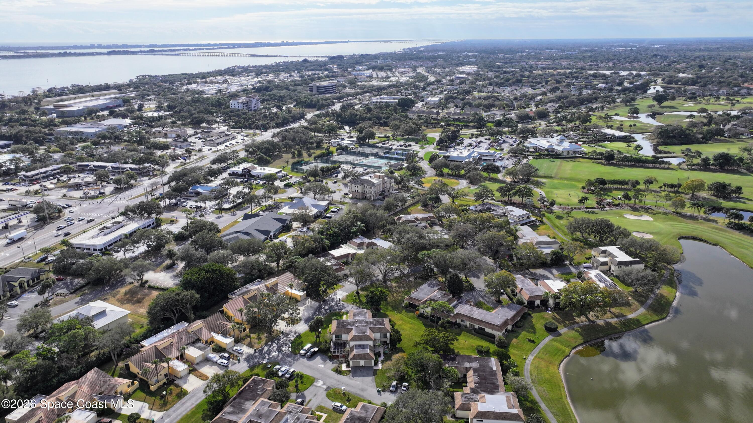 204 Country Club Drive Melbourne, FL 32940 - Photo 37 of 63 an aerial view of a city with lots of residential buildings