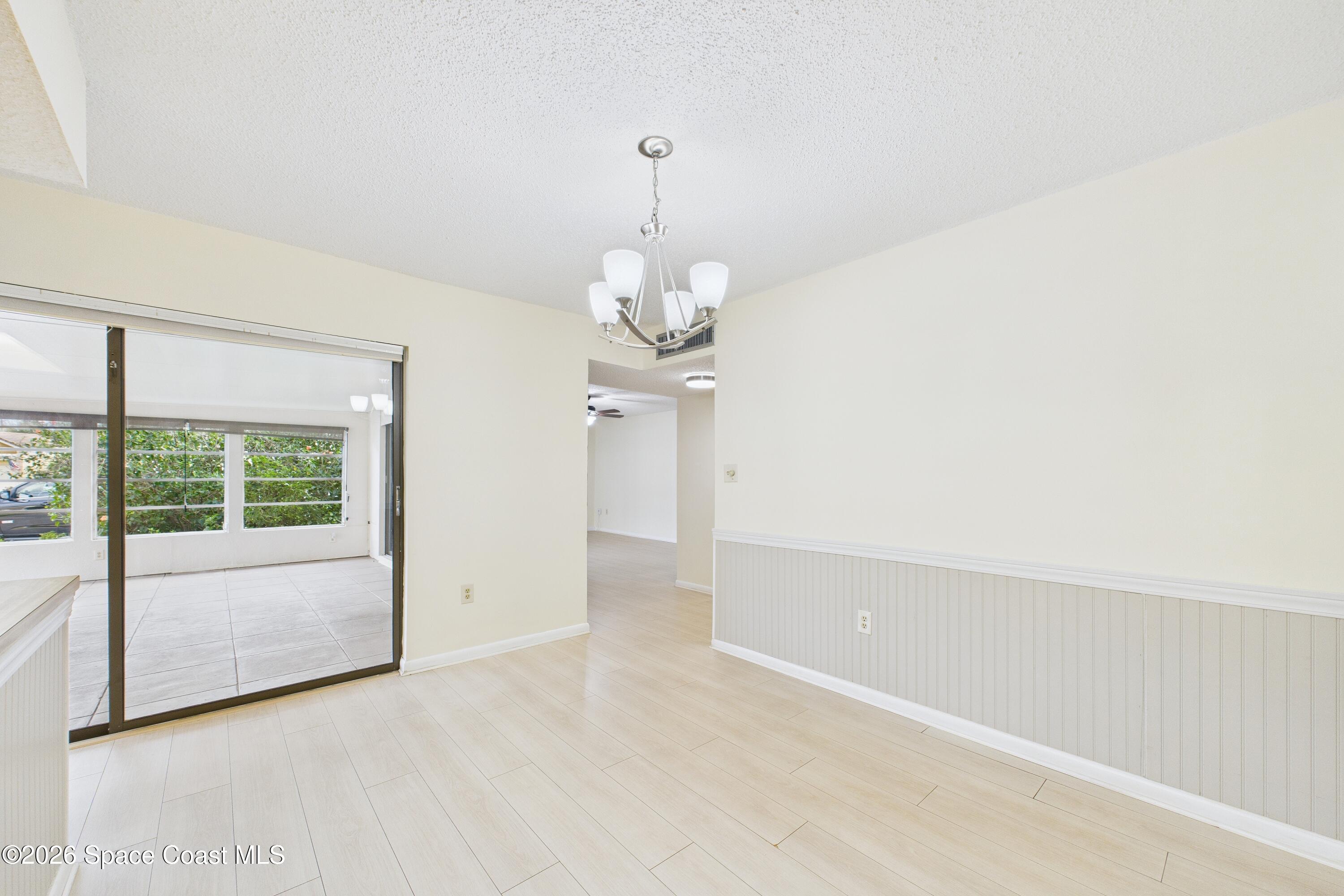 204 Country Club Drive Melbourne, FL 32940 - Photo 8 of 63 a view of an empty room with a window