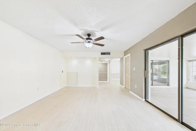 a large kitchen with kitchen island stainless steel appliances microwave and stove top oven