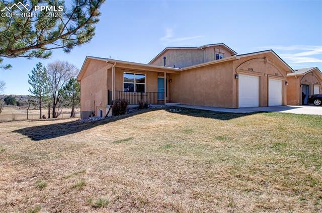 3579 Indigo Ridge Point Colorado Springs, CO 80910 - Photo 2 of 33 Front of townhome