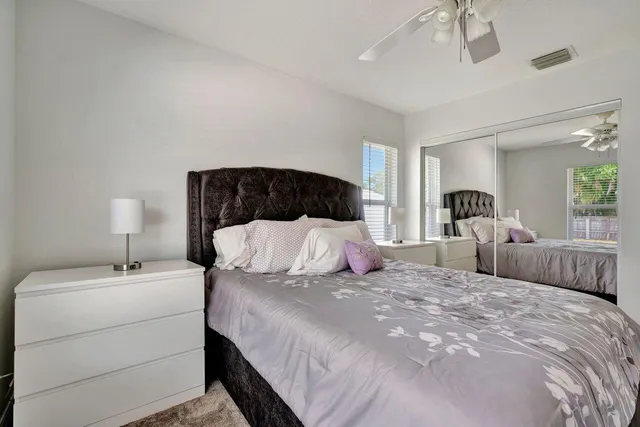 a bedroom with double bed and a night stand