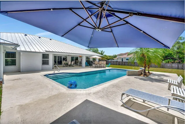front view of a house with a swimming pool