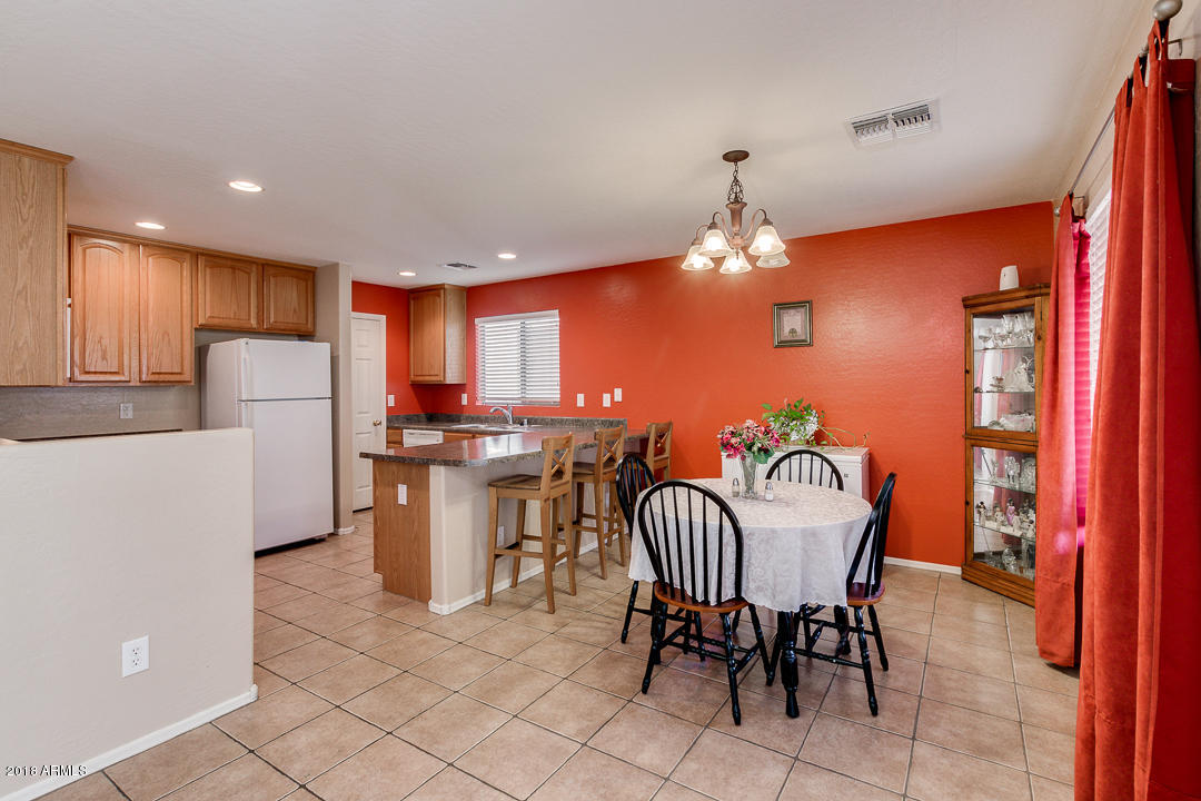 6664 East Refuge Road Florence, AZ 85132 - Photo 6 of 37 6664RefugeDiningroomKitchen