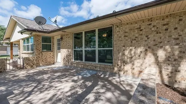 a front view of a house with a large window