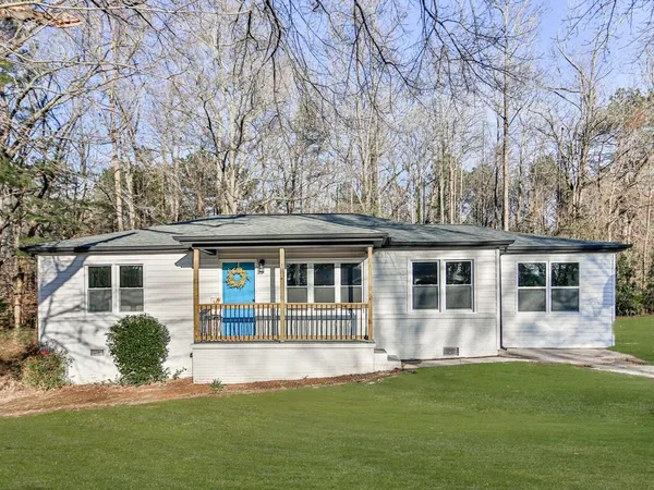 front view of a house with a yard