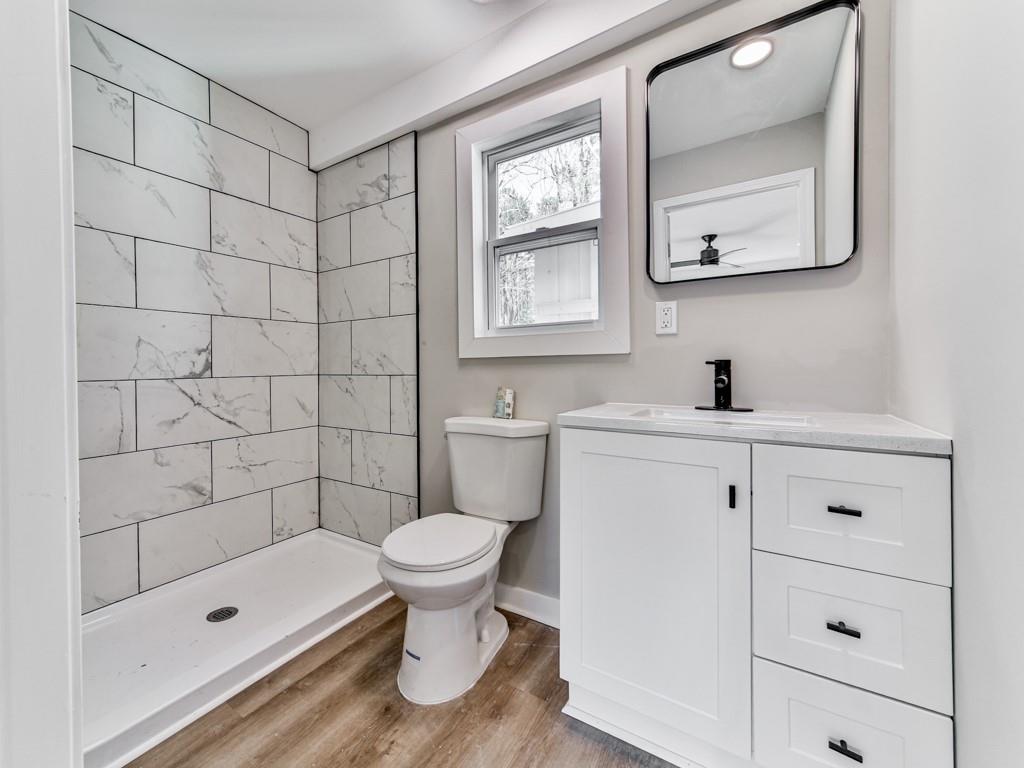 5205 Silhouette Lane Southwest Mableton, GA 30126 - Photo 18 of 21 a bathroom with a sink toilet a mirror and shower