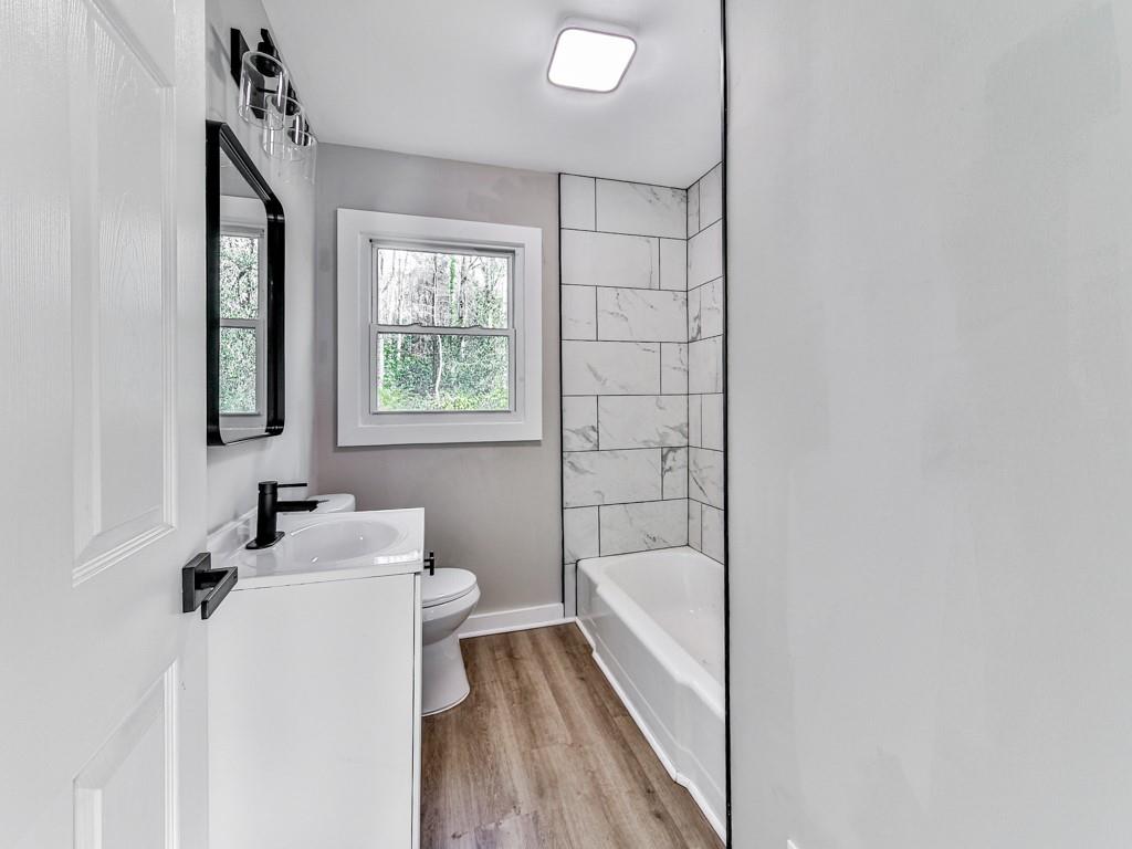 5205 Silhouette Lane Southwest Mableton, GA 30126 - Photo 19 of 21 a bathroom with a sink mirror toilet and bathtub