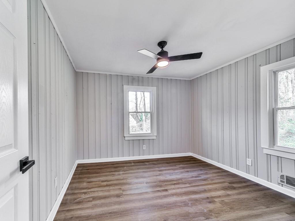 5205 Silhouette Lane Southwest Mableton, GA 30126 - Photo 20 of 21 a view of an empty room with wooden floor and a window
