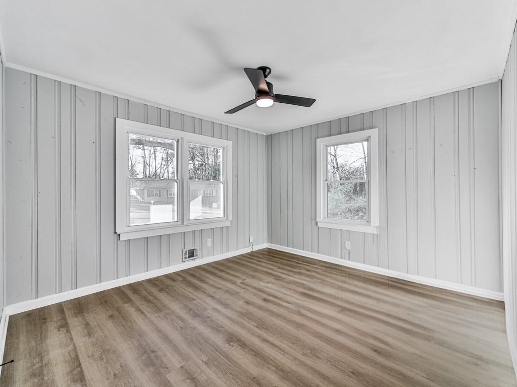5205 Silhouette Lane Southwest Mableton, GA 30126 - Photo 21 of 21 a view of an empty room with wooden floor and a window