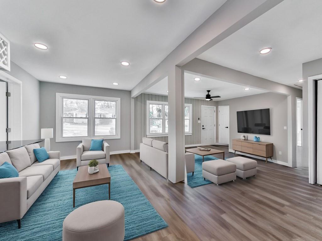 5205 Silhouette Lane Southwest Mableton, GA 30126 - Photo 10 of 21 a living room with furniture and a flat screen tv