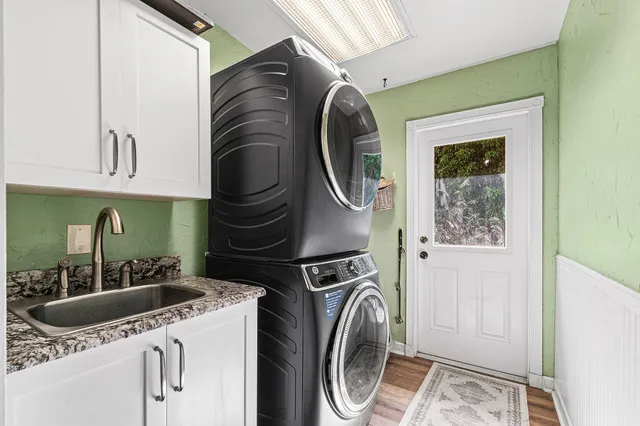 a utility room with multiple dryer and washer