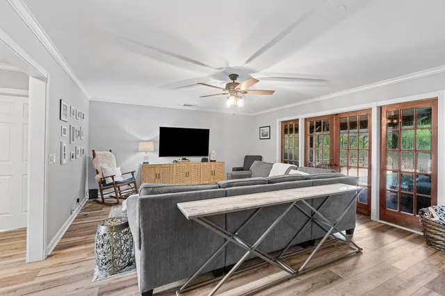 a view of a livingroom with furniture and a flat screen tv