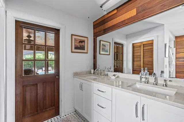 a bathroom with a sink and a window