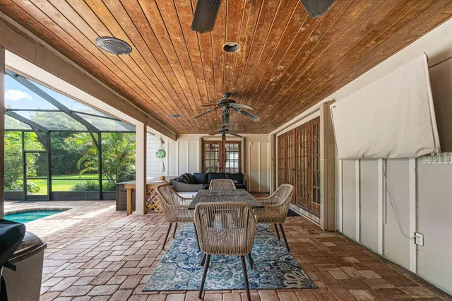a dining room with furniture and wooden floor