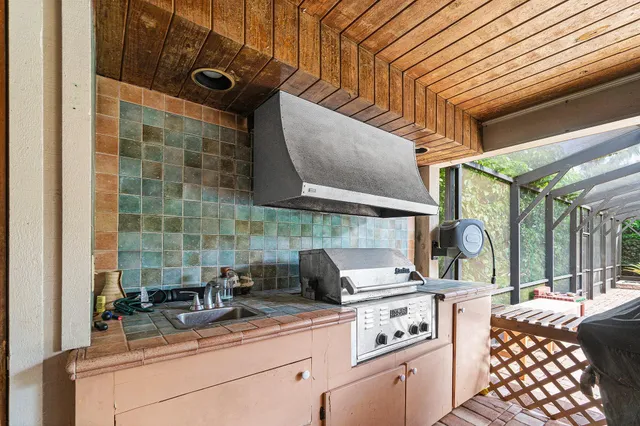 a kitchen with a sink and cabinets