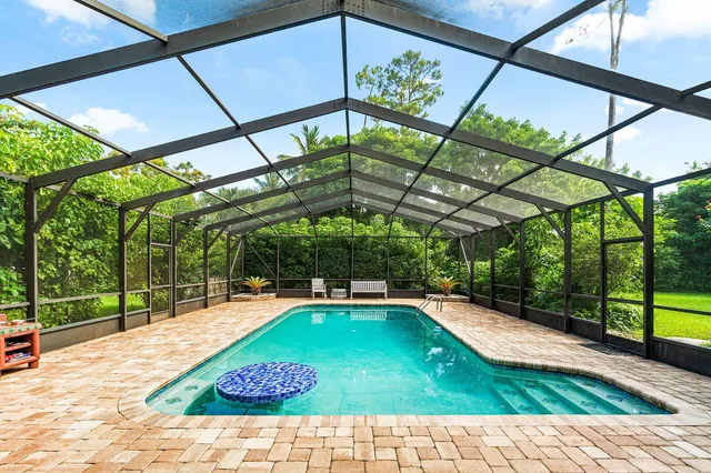 a view of swimming pool with a patio