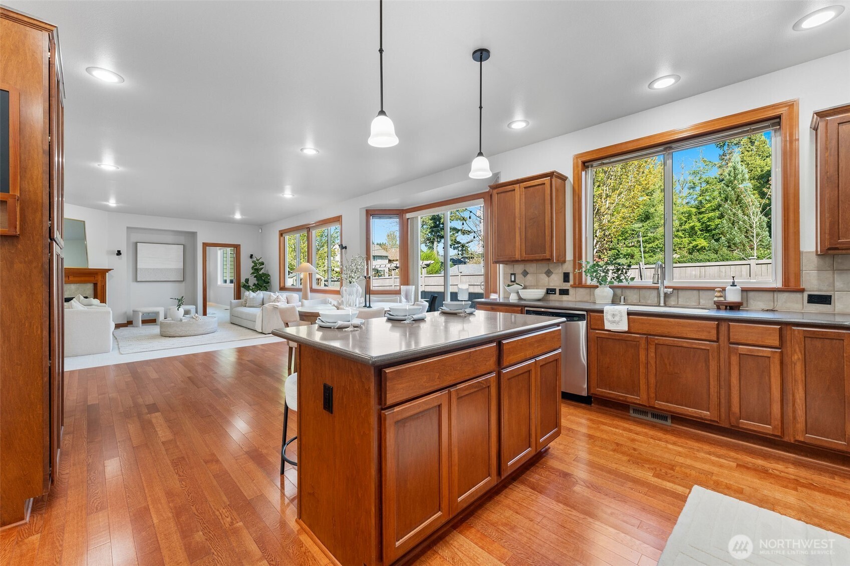 202 Chelan Court Northeast Renton, WA 98059 - Photo 11 of 40 a large kitchen with kitchen island a large island in it