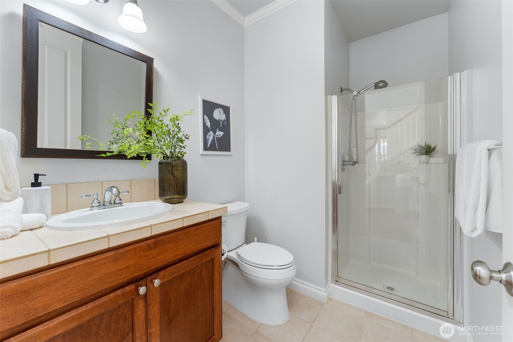 202 Chelan Court Northeast Renton, WA 98059 - Photo 19 of 40 a bathroom with a sink a toilet and shower