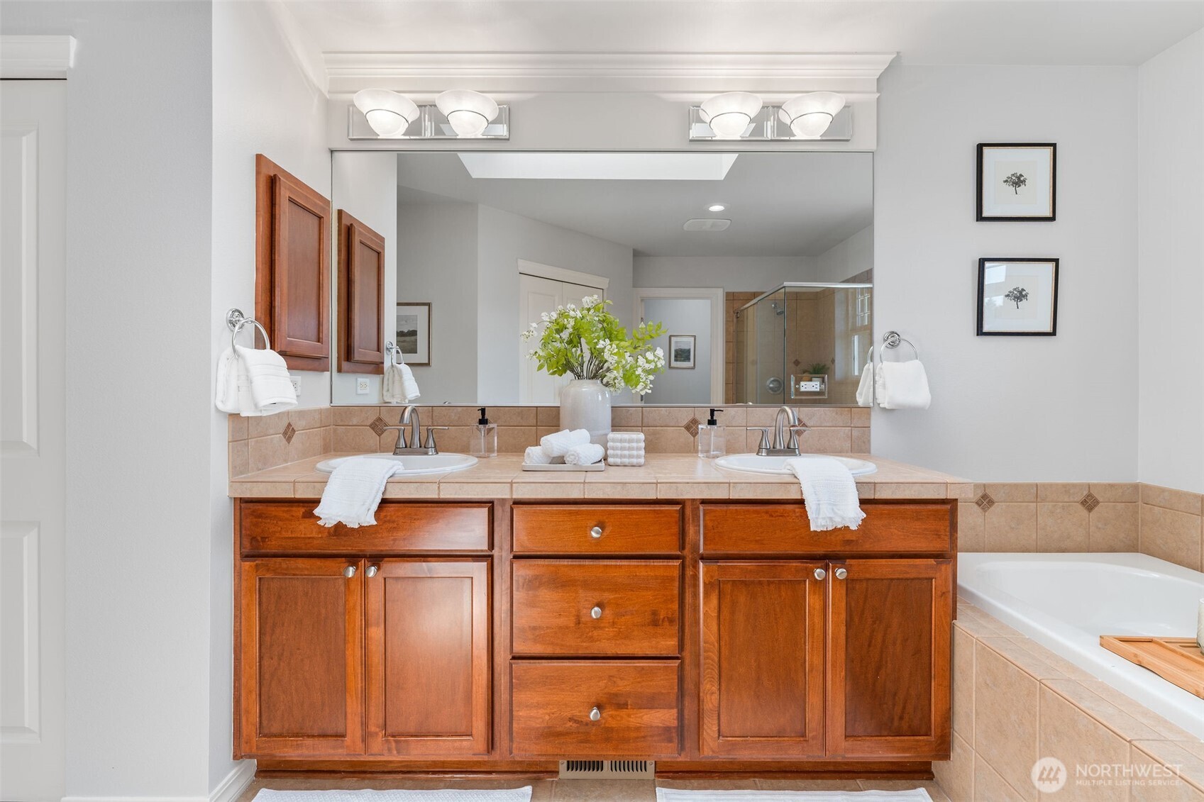 202 Chelan Court Northeast Renton, WA 98059 - Photo 23 of 40 a bathroom with a sink and a mirror