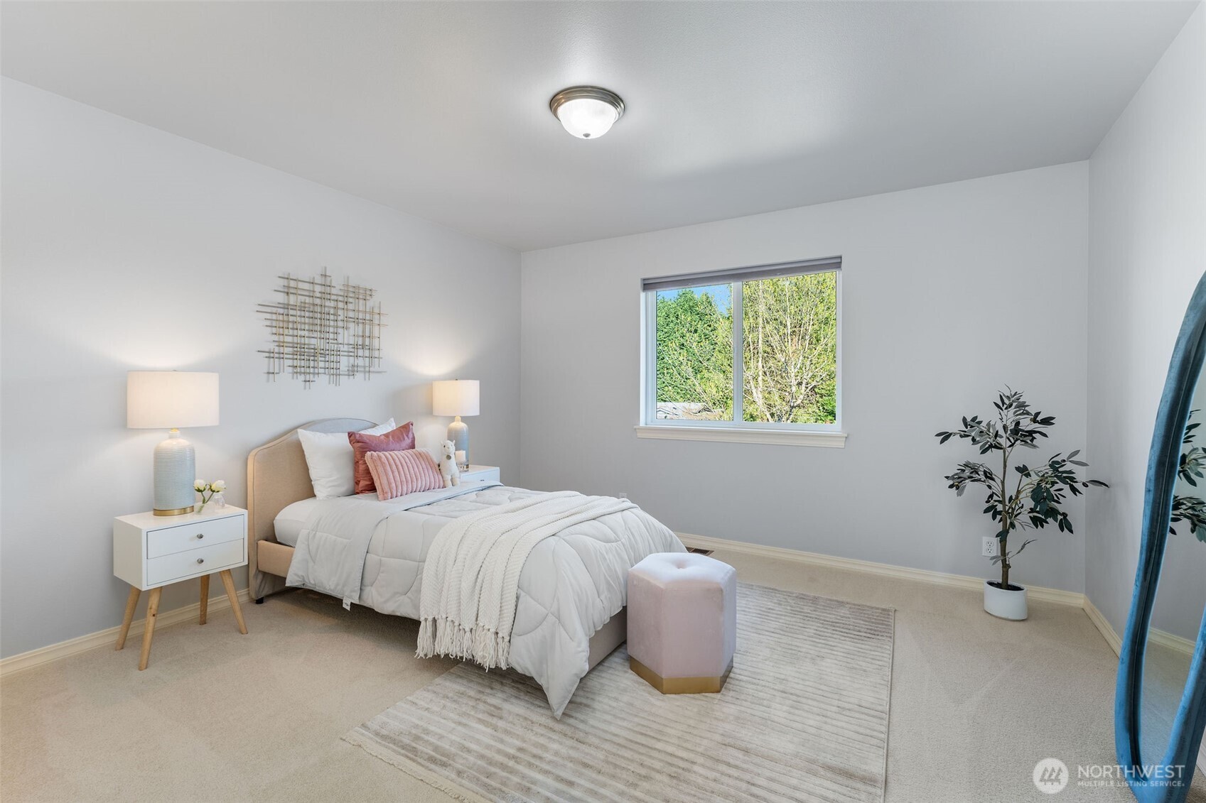 202 Chelan Court Northeast Renton, WA 98059 - Photo 28 of 40 a bedroom with a bed and a potted plant