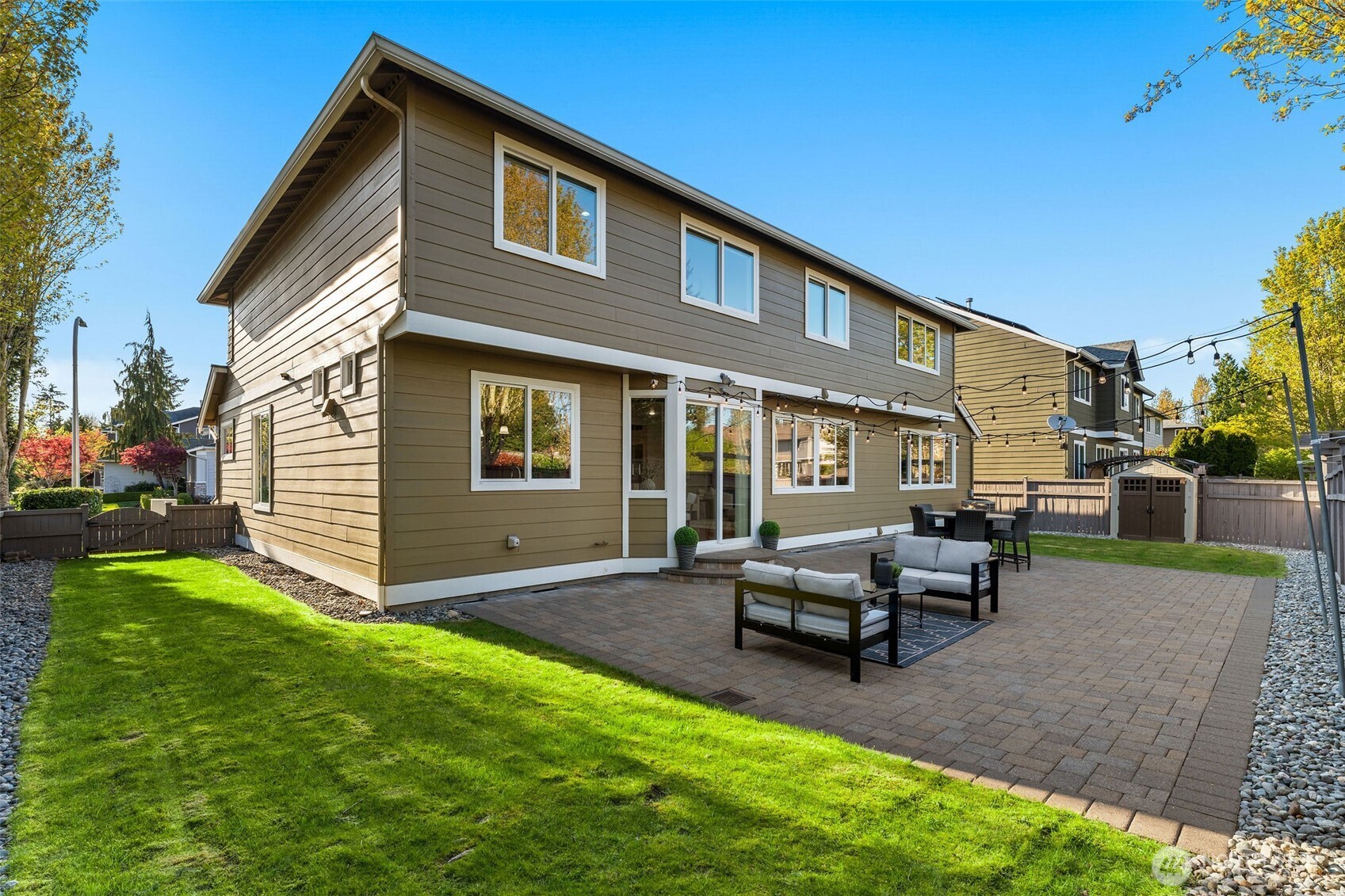 202 Chelan Court Northeast Renton, WA 98059 - Photo 31 of 40 a backyard of a house with table and chairs