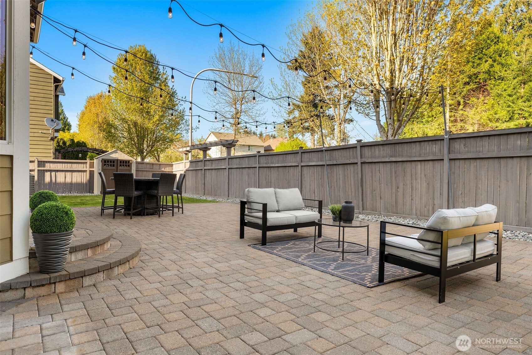 202 Chelan Court Northeast Renton, WA 98059 - Photo 32 of 40 a outdoor living space with furniture and a fireplace
