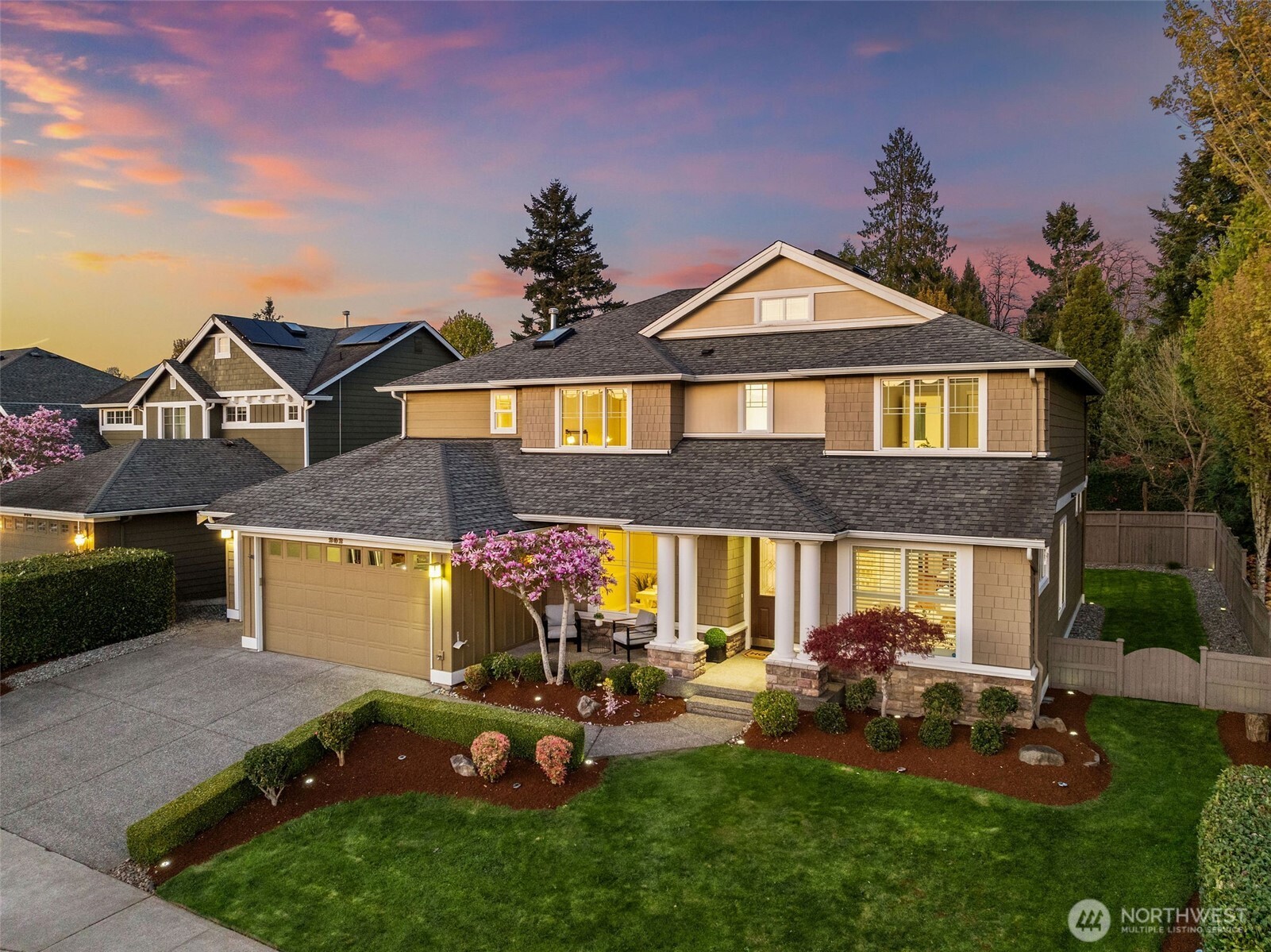 202 Chelan Court Northeast Renton, WA 98059 - Photo 36 of 40 a front view of a house with a garden and yard