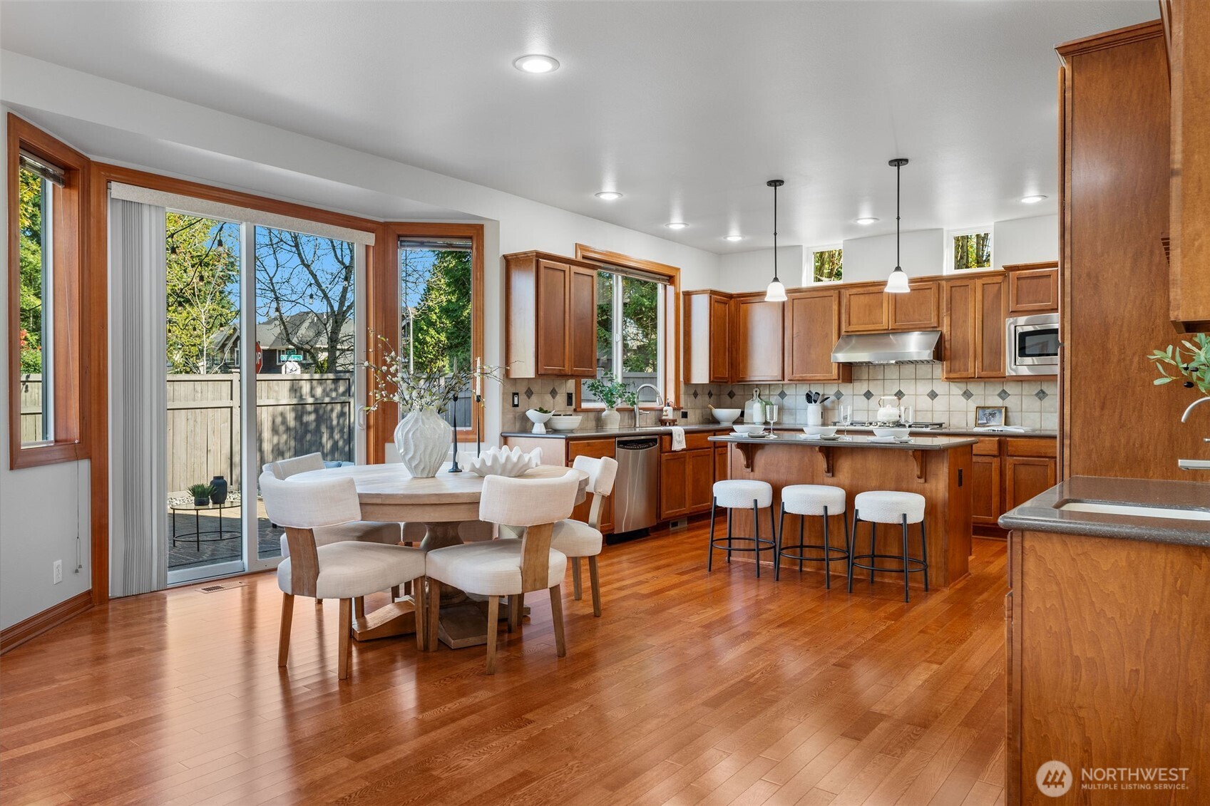 202 Chelan Court Northeast Renton, WA 98059 - Photo 7 of 40 a large dining space with furniture window and wooden floor