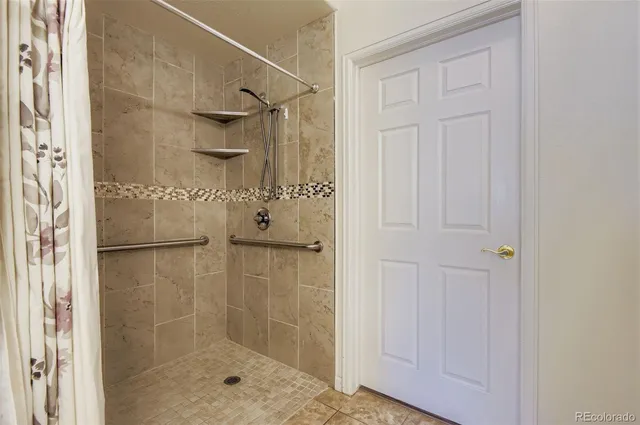 a bathroom with a glass shower door