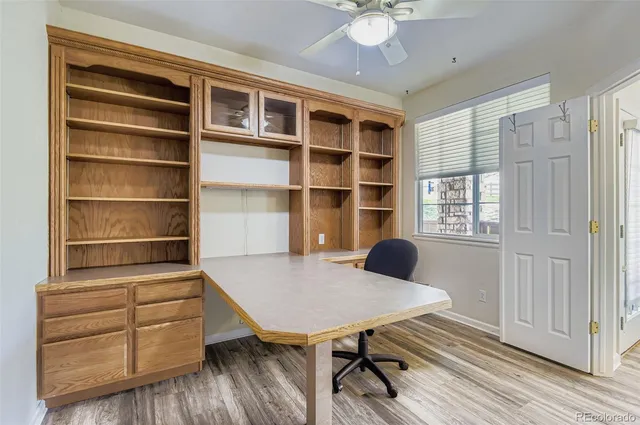 a workspace with furniture window and wooden floor